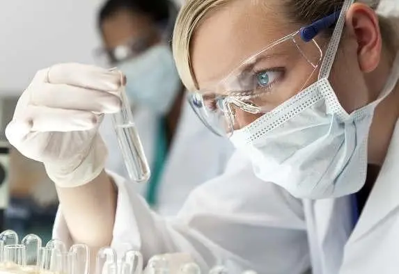 Scientist testing formula in lab